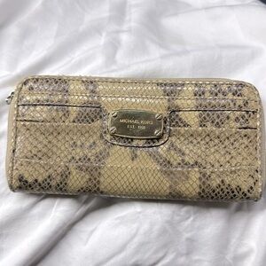 Alligator skin wallet by M. Kors 
Mint condition comes with a matching purse